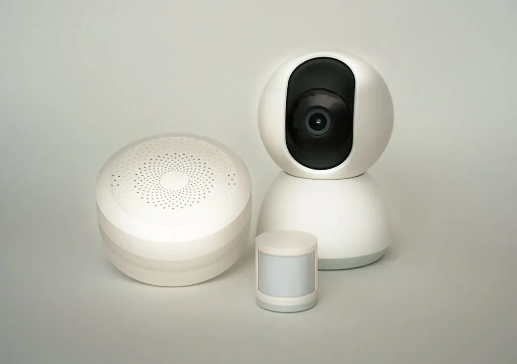 Smart home security devices including hub camera and motion sensor — alarm sensors explained