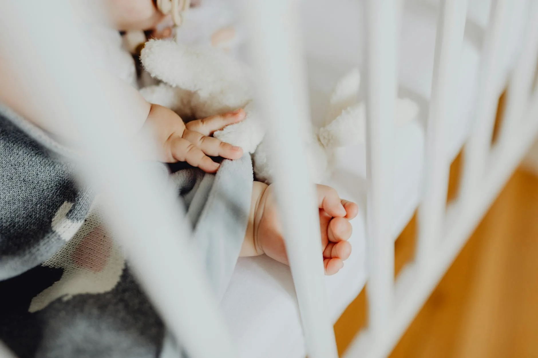 Baby sleeping peacefully in a nursery crib