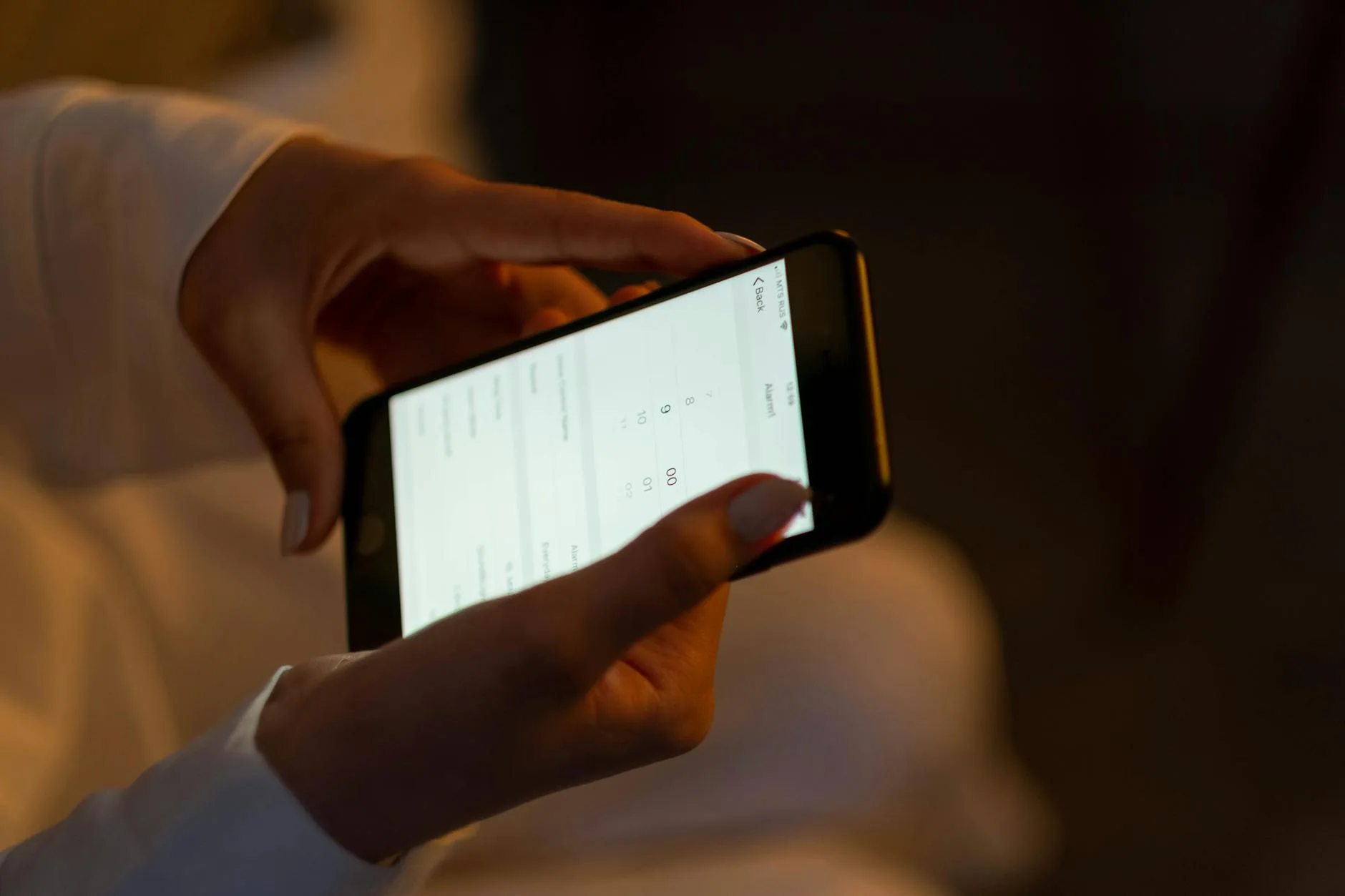 Person checking video doorbell notification on smartphone