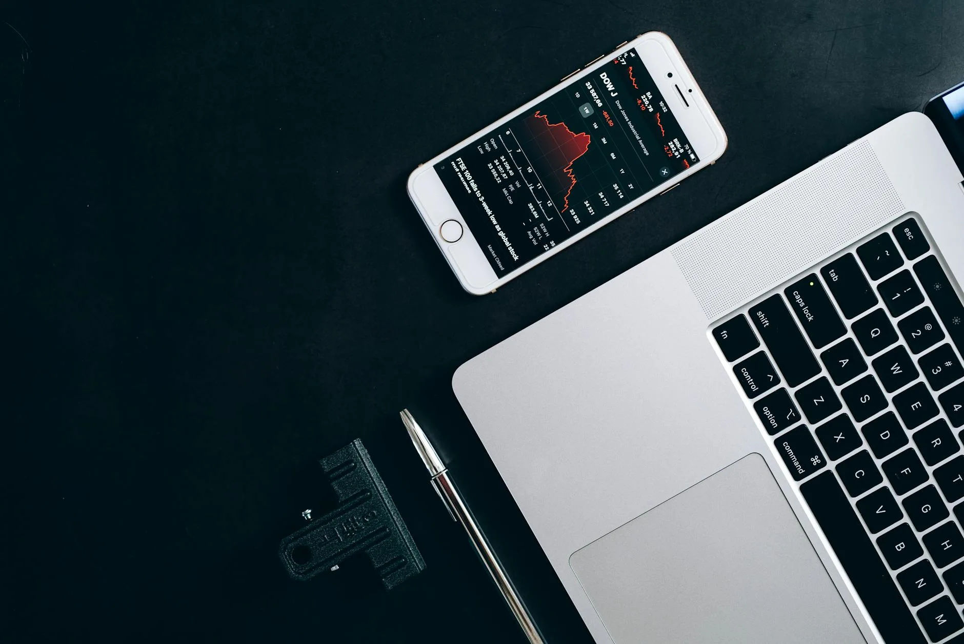 Phone screen showing data analytics and monitoring graphs