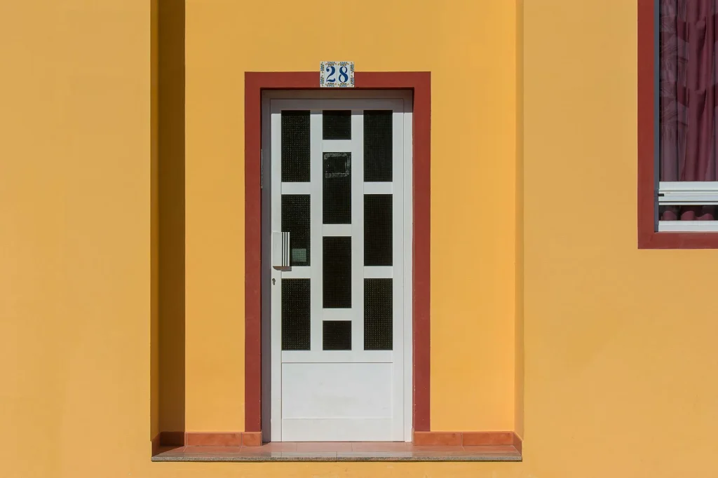 Modern front door with a smart doorbell installed