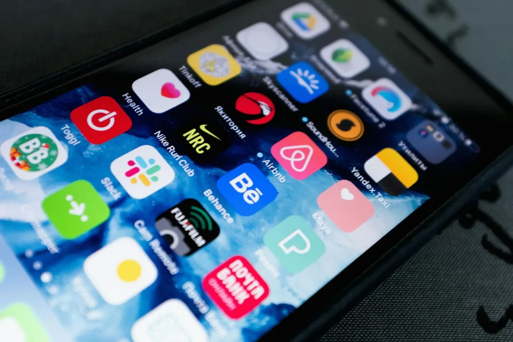 Person using phone app to control smart home devices