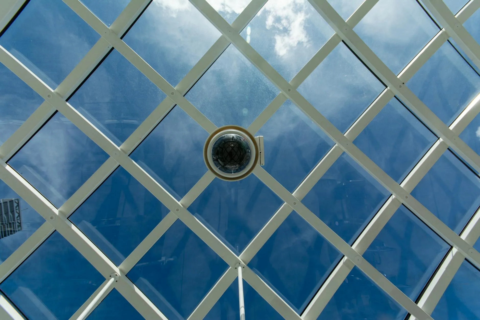Dome security camera mounted on an indoor ceiling