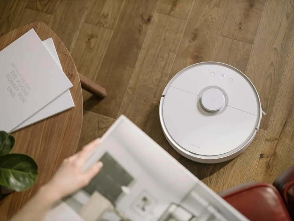 Robot vacuum cleaner on a living room floor during cleaning
