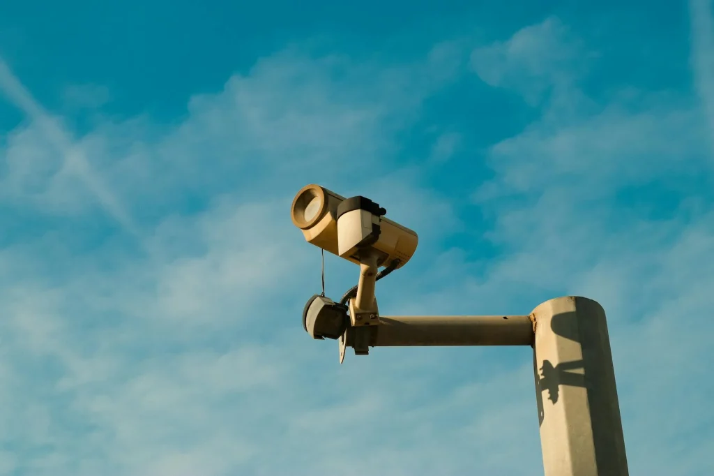 Security camera mounted on an outdoor house wall