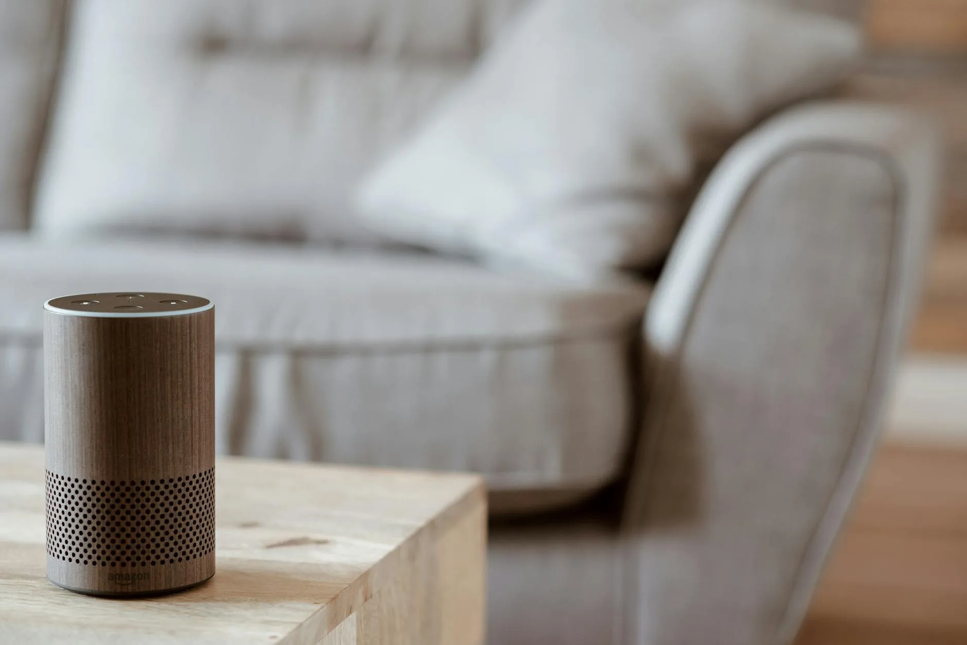 Amazon Echo smart speaker on a coffee table for voice-controlled home alarm