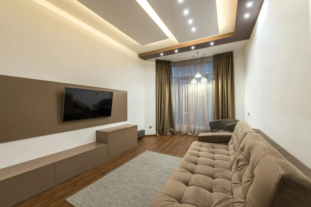 Modern living room with warm pendant lamps and cosy sofa lighting