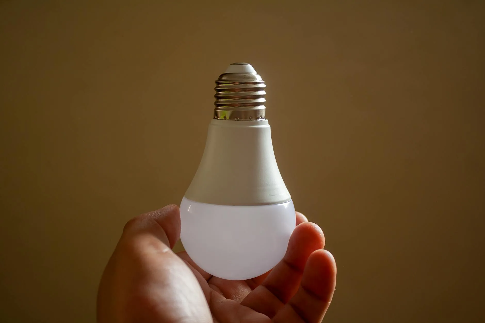 Smart LED light bulbs in a modern kitchen with warm lighting