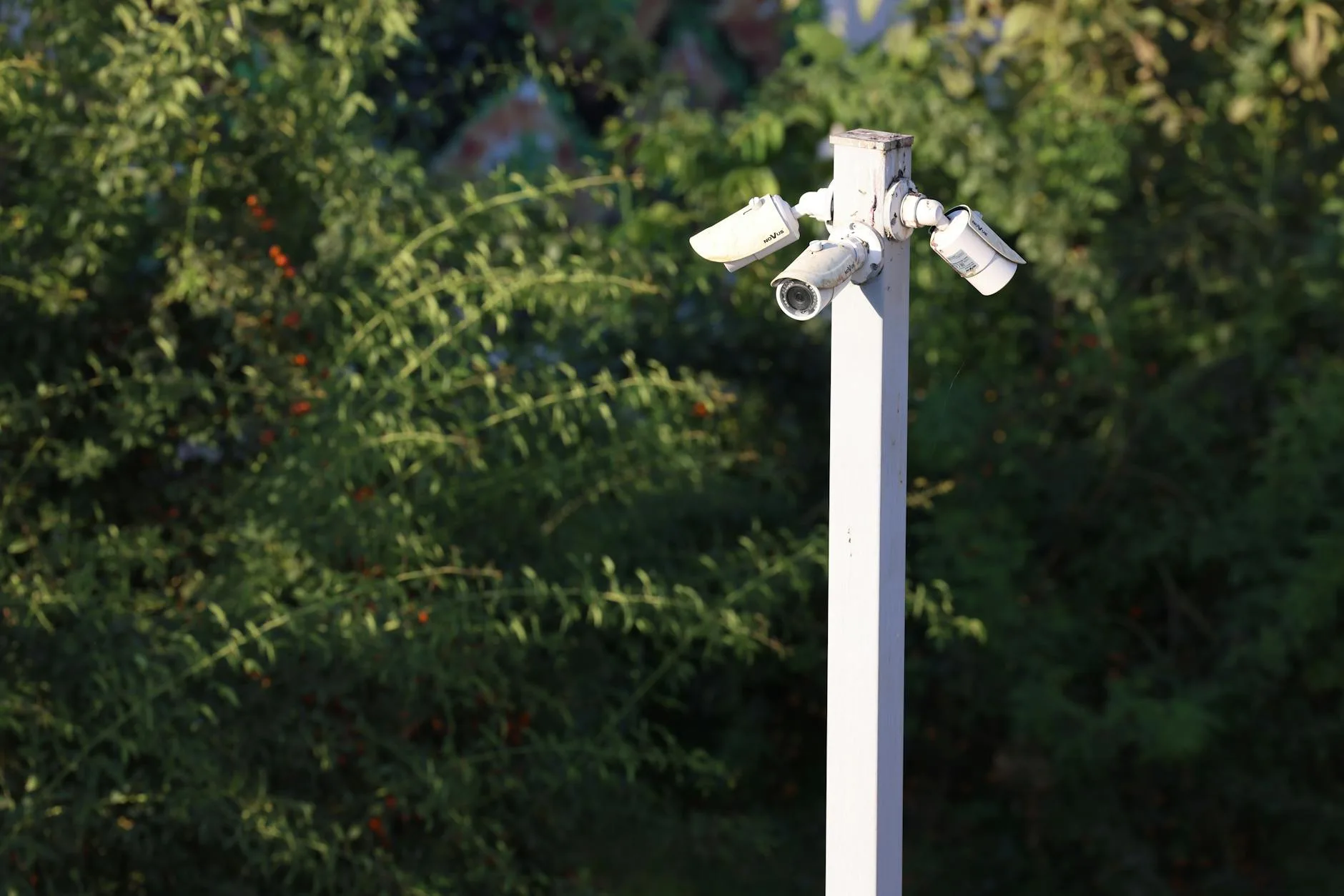 Outdoor security camera mounted on a home exterior