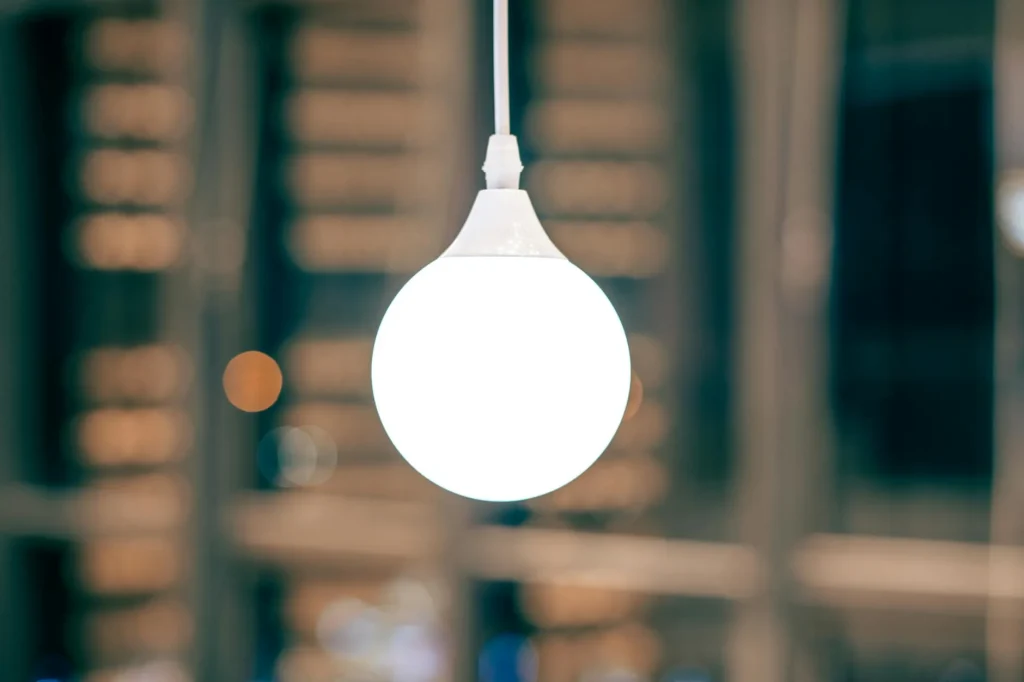 Smart light bulbs casting colourful ambient glow in a modern living room