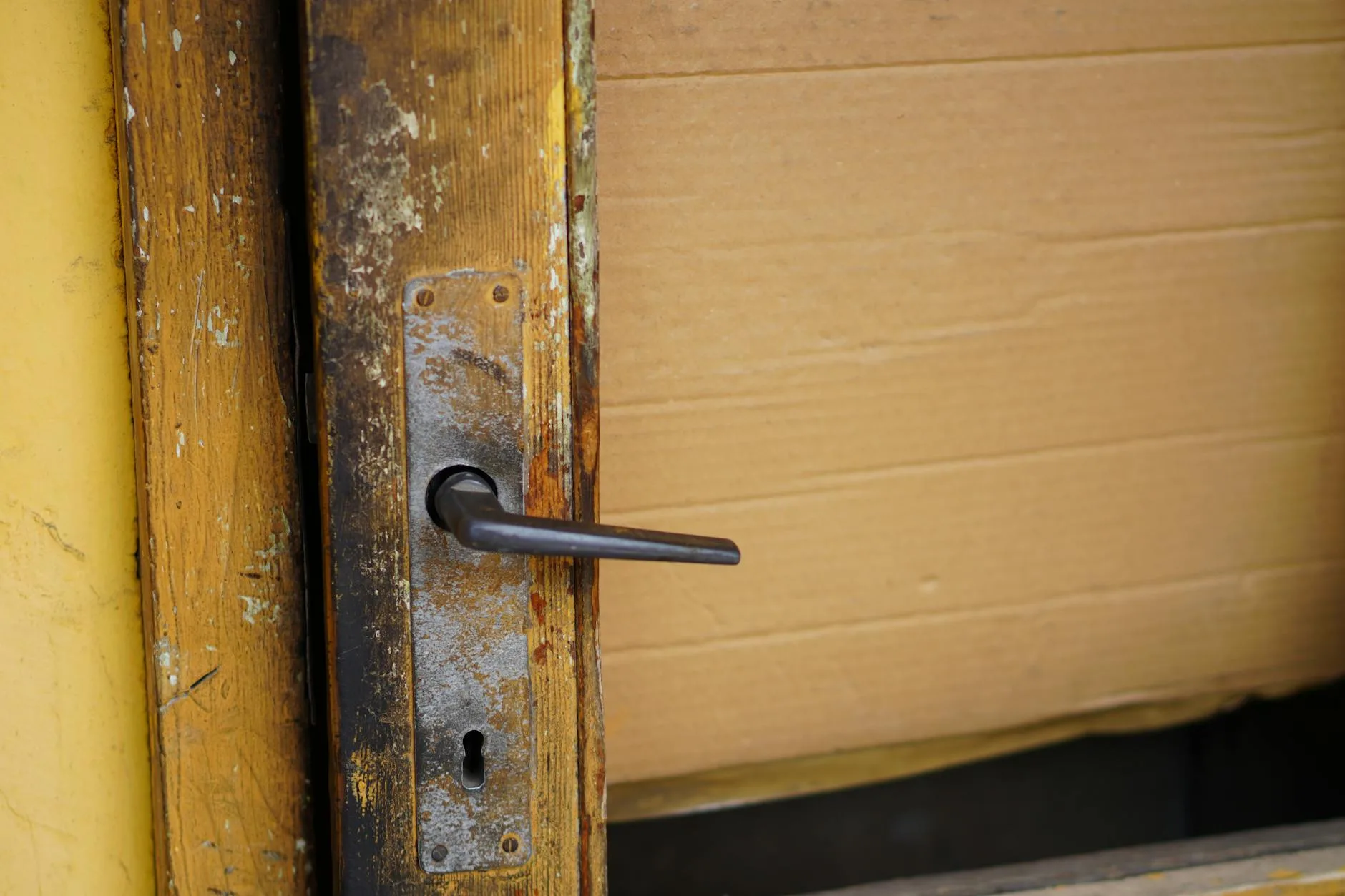 Close-up of a door handle and lock on a UK front door