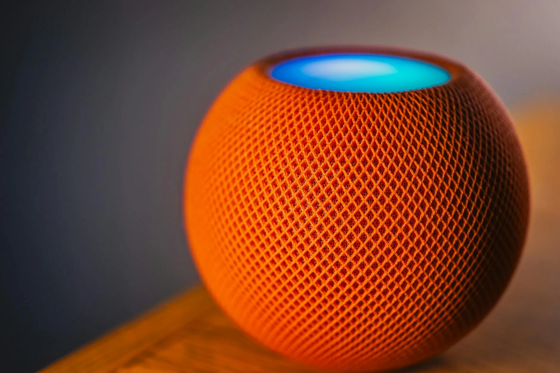 Smart home speaker on a shelf in a modern living room