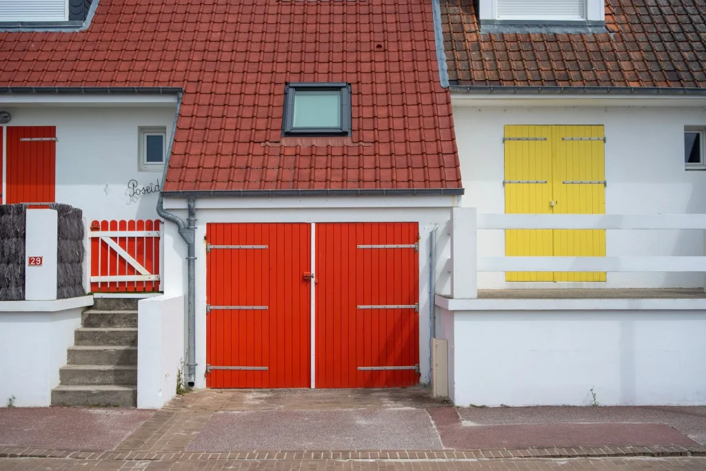 Using a smartphone to control a smart garage door in front of a British home