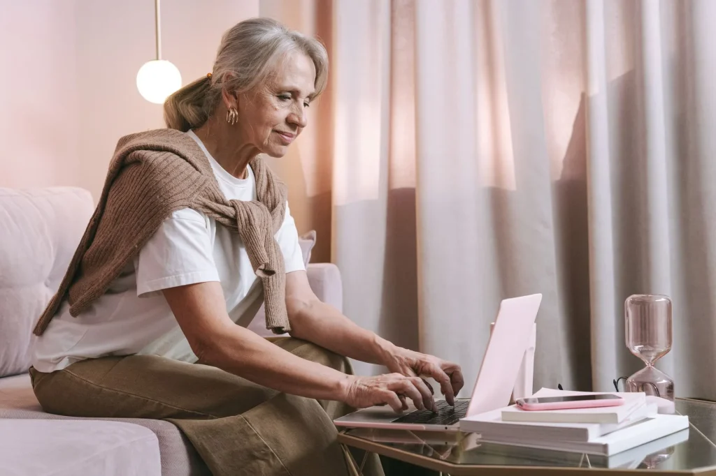Older person using a smart speaker at home for a simple smart home setup